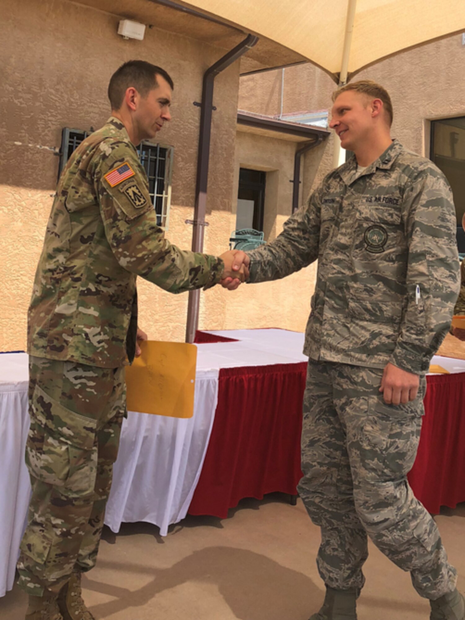 Capt. Jason Allenton, right, assigned to the 225th Air Defense Squadron, graduates from Air Defense Artillery Fire Control Officers (ADAFCO), Kirkland Air Force Base, New Mexico, July 27, 2018.   Experience gained at the ADAFCO course assists the Western Air Defense Sector in mission planning, execution and coordination of Army assets as part of Operation Noble Eagle. (Courtesy photo by Capt. Jason Allenton)