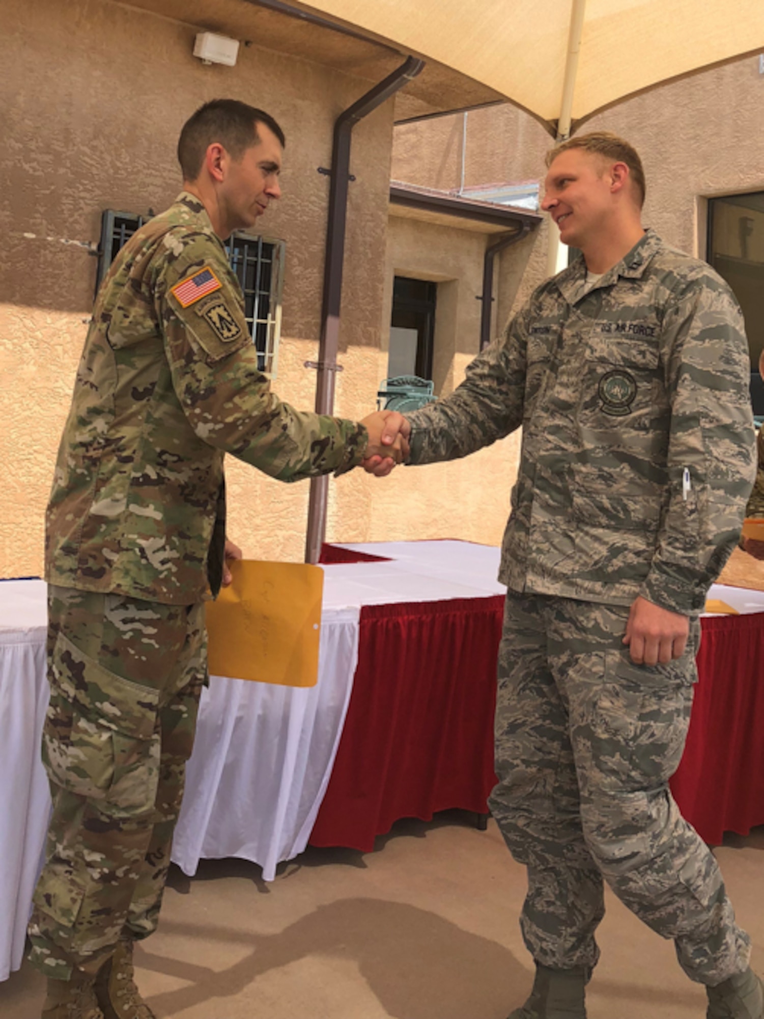 Capt. Jason Allenton, right, assigned to the 225th Air Defense Squadron, graduates from Air Defense Artillery Fire Control Officers (ADAFCO), Kirkland Air Force Base, New Mexico, July 27, 2018.   Experience gained at the ADAFCO course assists the Western Air Defense Sector in mission planning, execution and coordination of Army assets as part of Operation Noble Eagle. (Courtesy photo by Capt. Jason Allenton)