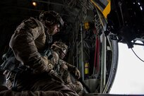 Master Sgt. Jim Brucculeri and Staff Sgt. Kareem Spearman from the 102nd Rescue Squadron, New York Air National Guard, scan for people in need of rescue over Kinston, N.C. Sept. 16, 2018. (U.S. Air Force photo by Senior Airman Kyle Hagan)