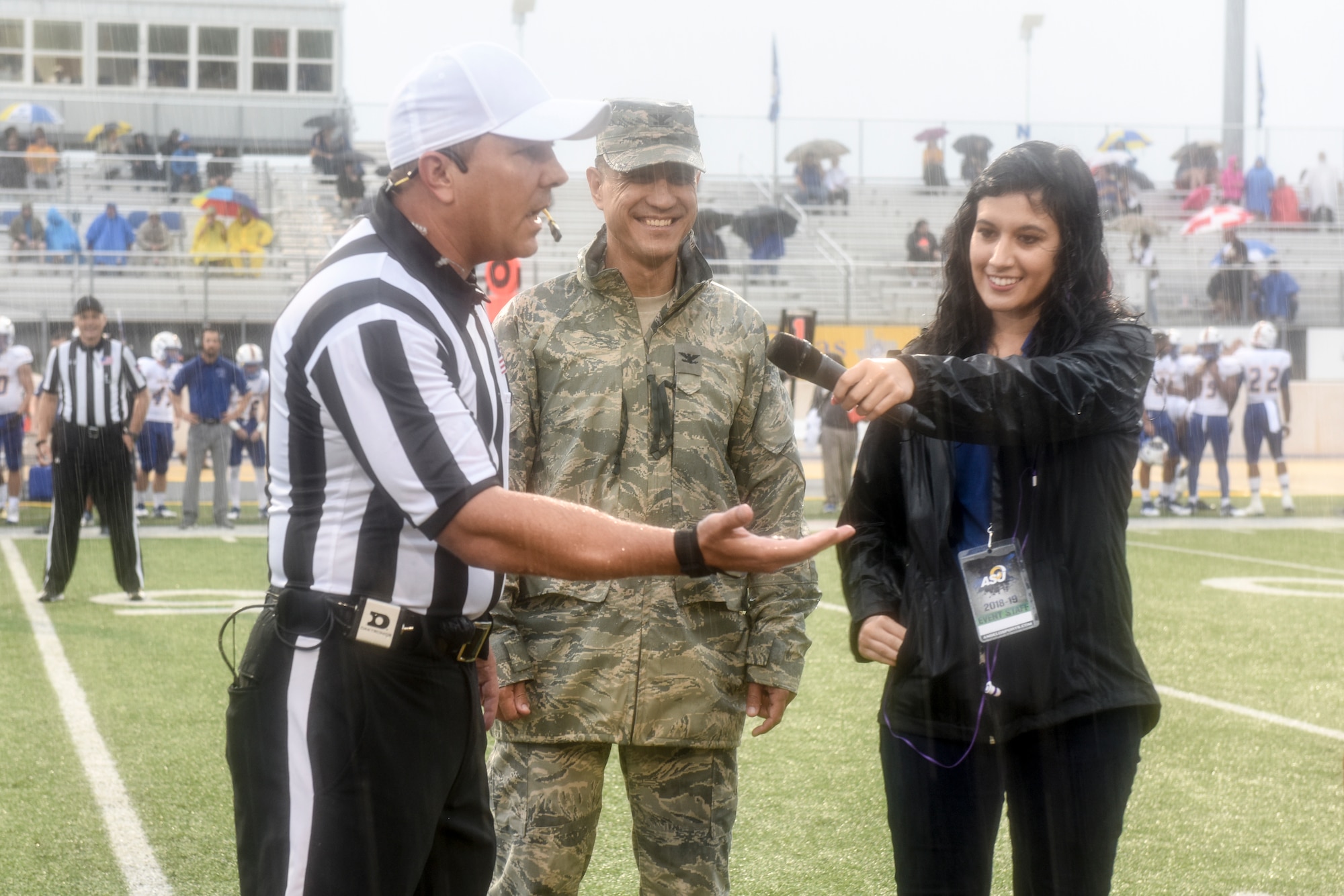 Head referee, Matt Jones, displays the coin used for the coin toss to start the game during the Military Appreciation Day, at the LeGrand stadium, in San Angelo, Texas, Sept. 15, 2018. Angelo State University played Texas A&M Kingsville in their Lone Star conference opener. (U.S. Air Force photo by Aryn Lockhart/Released)