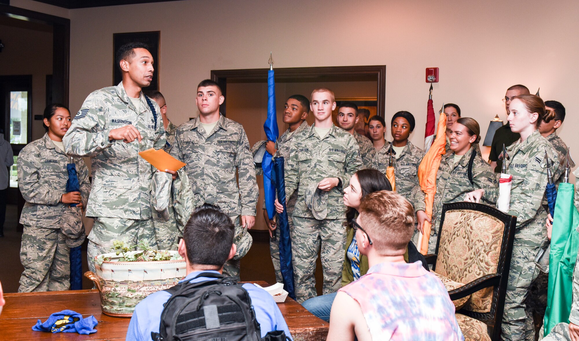 U.S. Air Force Tech. Sgt. Joseph Washington, 312th Training squadron military training leader, provides last minute details to the volunteers participating during the Military Appreciation Day at the LeGrand Alumni and Visitors Center, in San Angelo, Texas, Sept. 15, 2018. Goodfellow Air Force Base provided 50 volunteers to carry state flags during the half-time show. (U.S. Air Force photo by Aryn Lockhart/Released)