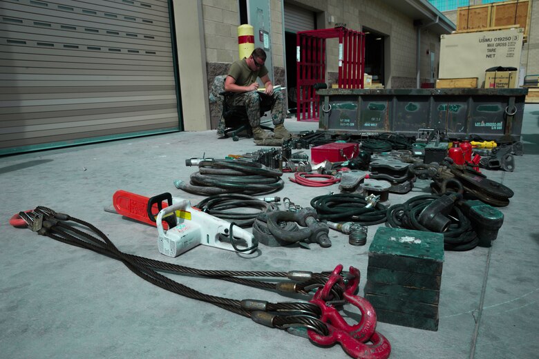 A Marine with H&S Company, 1st Tank Battalion, checks a vehicle inventory sheet off on the 1st Tank Battalion ramp aboard the Marine Corps Air Ground Combat Center, Twentynine Palms Calif., August 29, 2018. Motor Transport Marines with 1st Tank Battalion increased overall readiness by 20% in the past three weeks by working extended hours. (Photo by Lance Cpl. Carley Vedro)