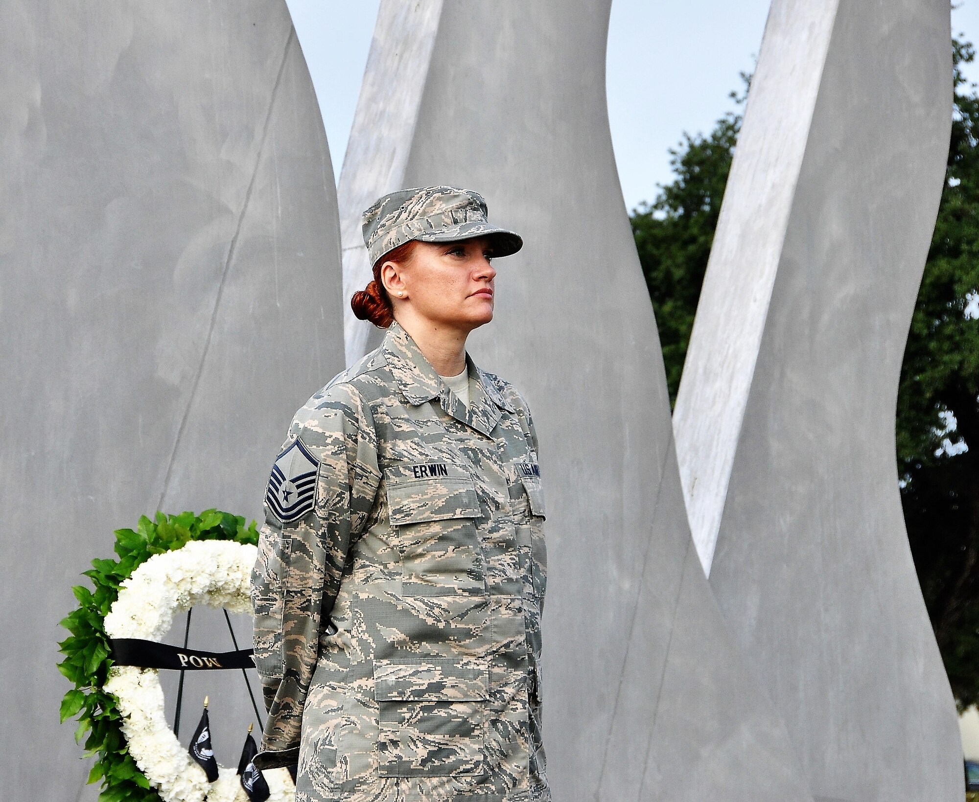 Master Sgt. Melissa Erwin, 340th Flying Training Group stands vigil at the Missing Man Monument during Sept. 17 POW/MIA Recognition Week observances at Joint Base San Antonio-Randolph, Texas. (U.S. Air Force photo by Janis El Shabazz)