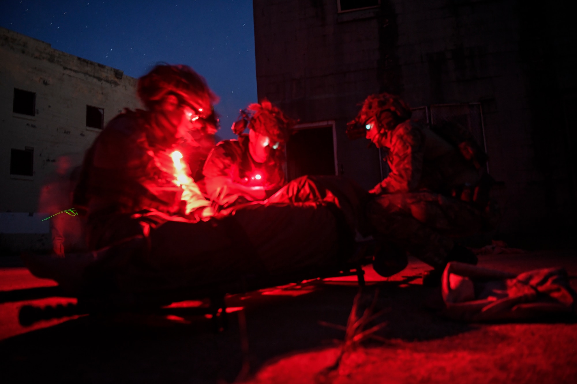 Special Tactics Airmen with the 17th Special Tactics Squadron perform medical treatment on a mannequin during medical field training at Fort Benning, Georgia, July 10, 2018.
