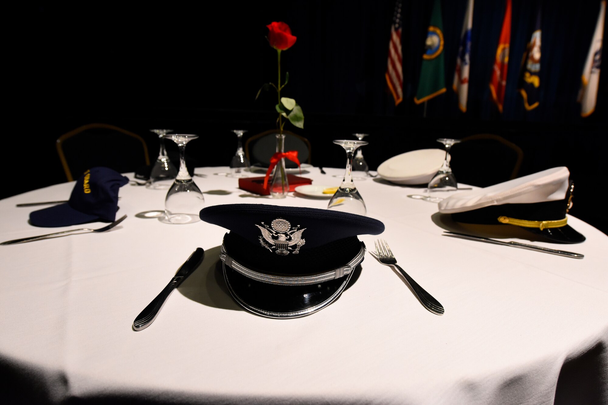 A table in memory of U.S. military prisoners of war and those missing in action stands near the stage at Fairchild's Air Force Ball at Northern Quest Resort and Casino in Airway Heights, Washington, Sept. 15, 2018. The tradition of setting a separate table in honor of POWs and MIA has been in place since the end of the Vietnam War. (U.S. Air Force photo/Airman 1st Class Lawrence Sena)