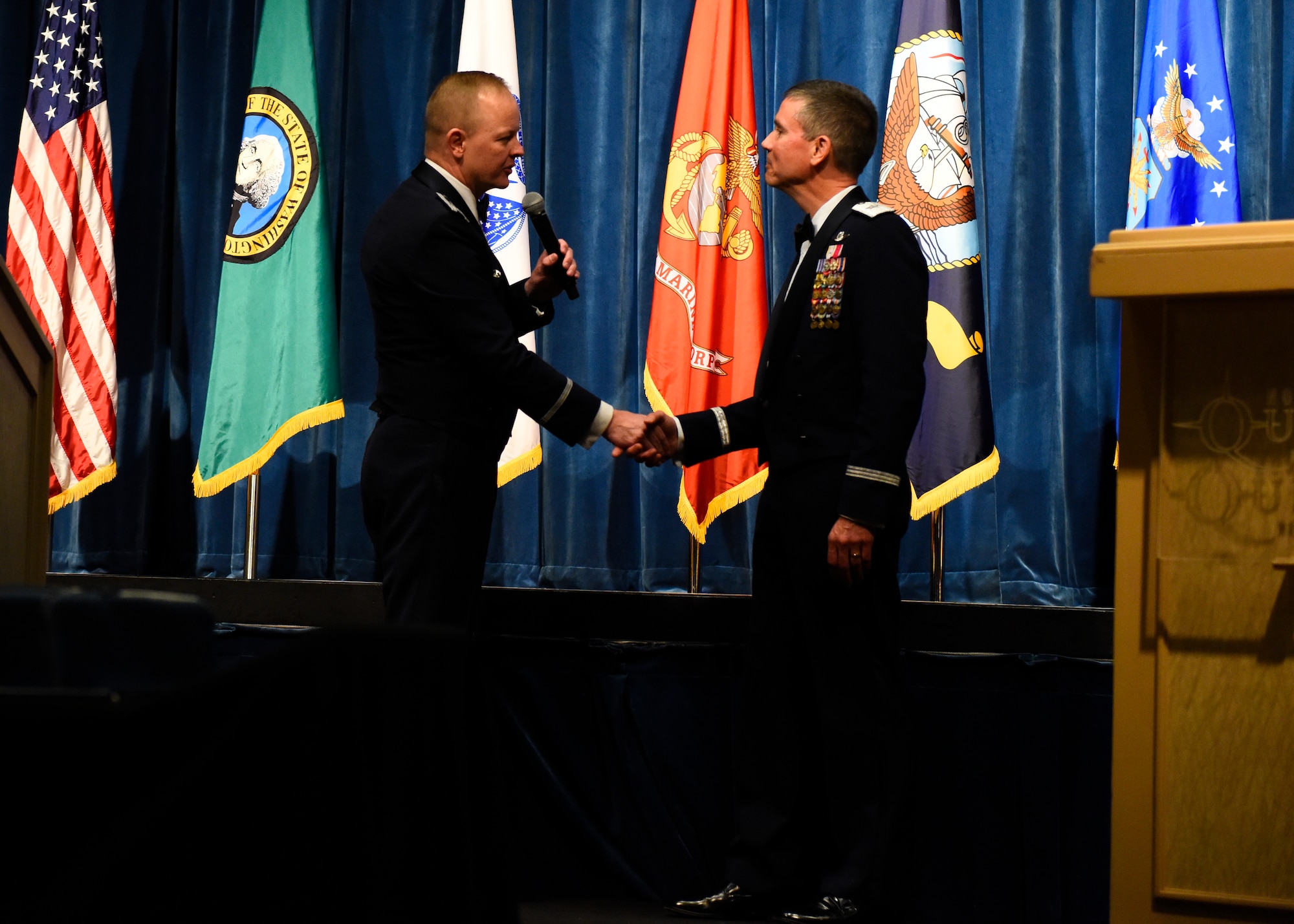 Col. Derek Salmi, 92nd Air Refueling Wing commander, thanks Brig. Gen. Paul Tibbets, Global Strike Command deputy commander, for being the guest speaker during Fairchild's Air Force Ball at Northern Resort and Casino in Airway Heights, Washington, Sept. 15, 2018. Salmi presented Tibbets with a Commander's Coin, along with several other gifts, as a sign of appreciation for speaking at and attending the Air Force Ball. (U.S. Air Force photo/Airman 1st Class Lawrence Sena)