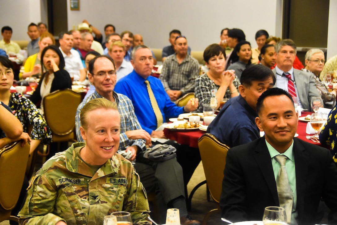 Col. Teresa Schlosser (left), U.S. Army Corps of Engineers, Far East District commander, shares a laugh with Jamie Hagio, Area Engineer, Humphreys Area office, during his Farewell luncheon held at Taproom restaurant, Camp Humphreys, Sep.12.