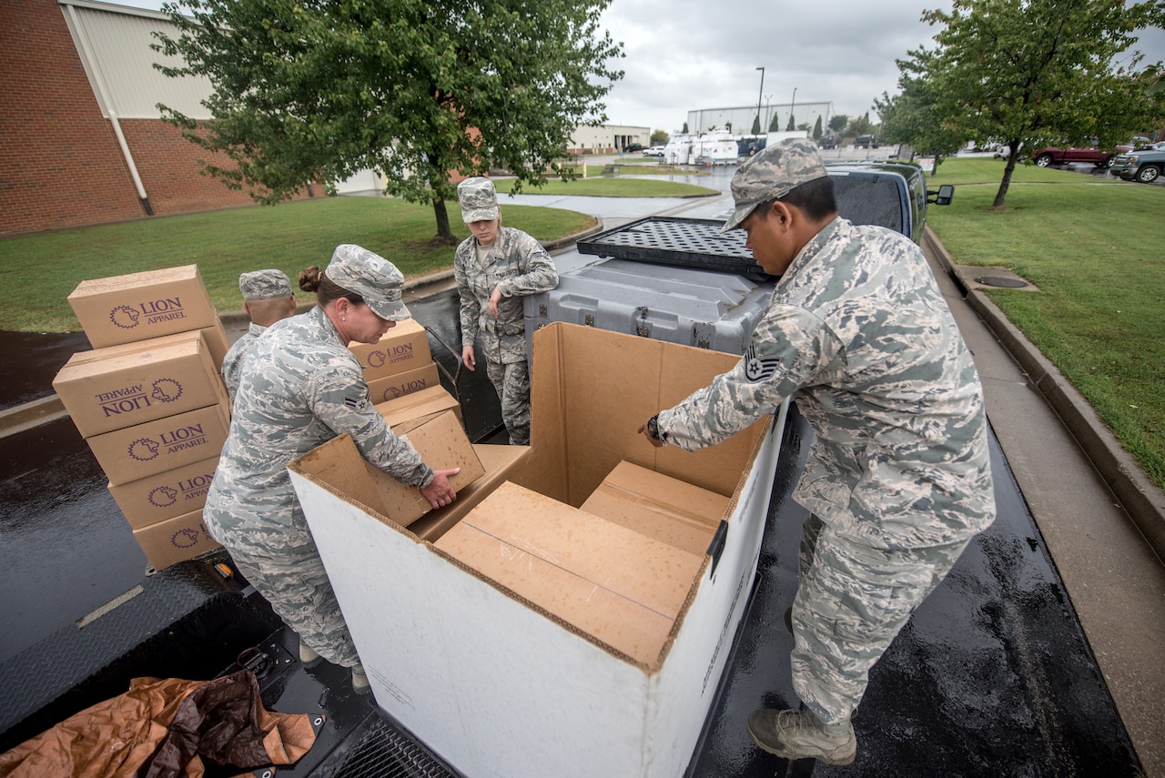 Members of the 123rd Airlift Wing’s Fatality Search and Recovery Team pack equipment at the Kentucky Air National Guard Base in Louisville, Ky., Sept. 17, 2018, prior to deploying to North Carolina to support operations in the wake of Hurricane Florence. The team, which specializes in the dignified recovery of deceased personnel, will assist the North Carolina medical examiner’s office at the request of local health officials.
