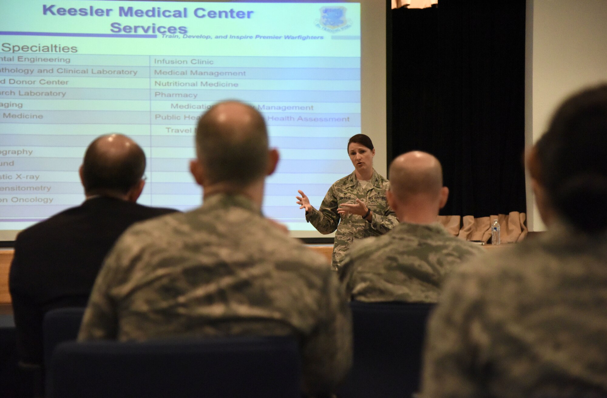 U.S. Air Force Col. Beatrice Dolihite, 81st Medical Group director and service commander, delivers the 81st MDG mission brief to Gen. Stephen Wilson, Vice Chief of Staff of the Air Force; Matthew Donovan, Under Secretary of the Air Force; Lt. Gen. Dorothy Hogg, Air Force Surgeon General, and Keesler Leadership at the Keesler Medical Center auditorium at Keesler Air Force Base, Mississippi, Sept. 10, 2018. The purpose of the visit was to become more familiar with the 81st MDG's mission capabilities prior to Keesler Medical Center's transition to the Defense Health Agency. (U.S. Air Force photo by Kemberly Groue)