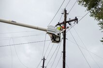 Utility workers with JCL Power Boyce L.A., repair damaged power lines on Marine Corps Air Station New River, N.C., Sept. 16, 2018. Hurricane Florence impacted Marine Corps Base Camp Lejeune and MCAS New River with periods of strong winds, heavy rains, flooding of urban and low lying areas, flash floods and coastal storm surges.  (U.S. Marine Corps photo by Lance Cpl. Damaris Arias)