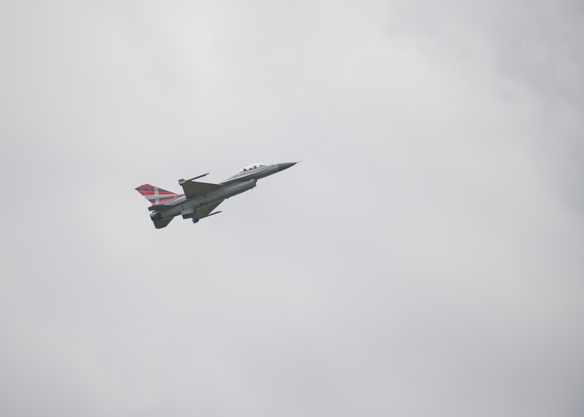 A Royal Danish Air Force F-16C Fighting Falcon flies above Ostrava Air Base, Czech Republic, during NATO Days. NATO Days is a Czech Republic-led air show and exhibition that showcases military ground and aviation capabilities from 19 nations. Participation in NATO Days increases our understanding of European ally and partner capabilities, greatly enhancing our ability to operate together as a team. (U.S. Navy photo by Mass Communication Specialist 2nd Class Robert J. Baldock)