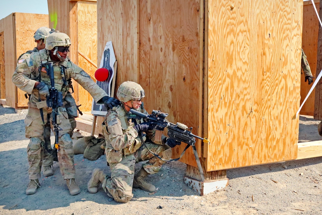 Soldiers clear rooms on an urban live-fire range during Exercise Rising Thunder 18.