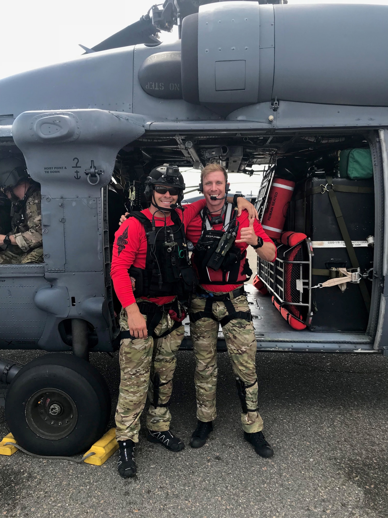 Air Force Reserve pararescuemen Senior Mastter Sgt. Joe Traska and Staff Sgt. Lucas Vannorsdall, 334th Air Expeditionary Group, take a moment to catch their breath after putting their readiness training in the keys on hold to posture for search-and-rescue operations at Joint Base Charleston, South Carolina in the wake of Hurricane Florence. Pararescuemen are highly trained combat rescue specialists. (U.S. Air Force photo by Tech. Sgt. Kelly Goonan)