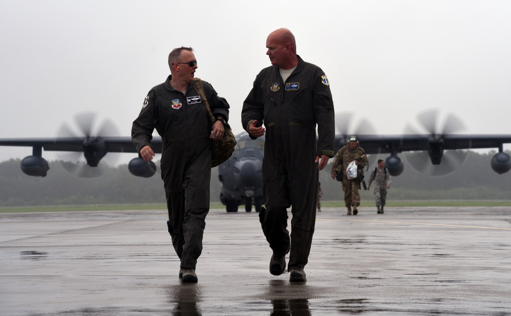 Col. Bryan Creel, 334th Air Expeditionary Group commander, discusses search-and-rescue operational plans with Lt. Col. Jeff Hannold, 334th AEG deputy commander, at Joint Base Charleston on Sept. 15, 2018. Airmen and equipment from the 334th AEG arrived aboard HC-130J Combat King II aircraft and HH-60G Pave Hawks from Moody Air Force Base. The 344th AEG are being pre-positioned to be ready to provide relief in the wake of tropical storm Florence. The 334th AEG is an expeditionary search and rescue unit comprised of 23d Wing and 920th Rescue Wing personnel and assets ready to perform surface, fixed wing and rotary SAR operations when needed. (U.S. Air Force Photo by Technical Sgt. Kelly Goonan)