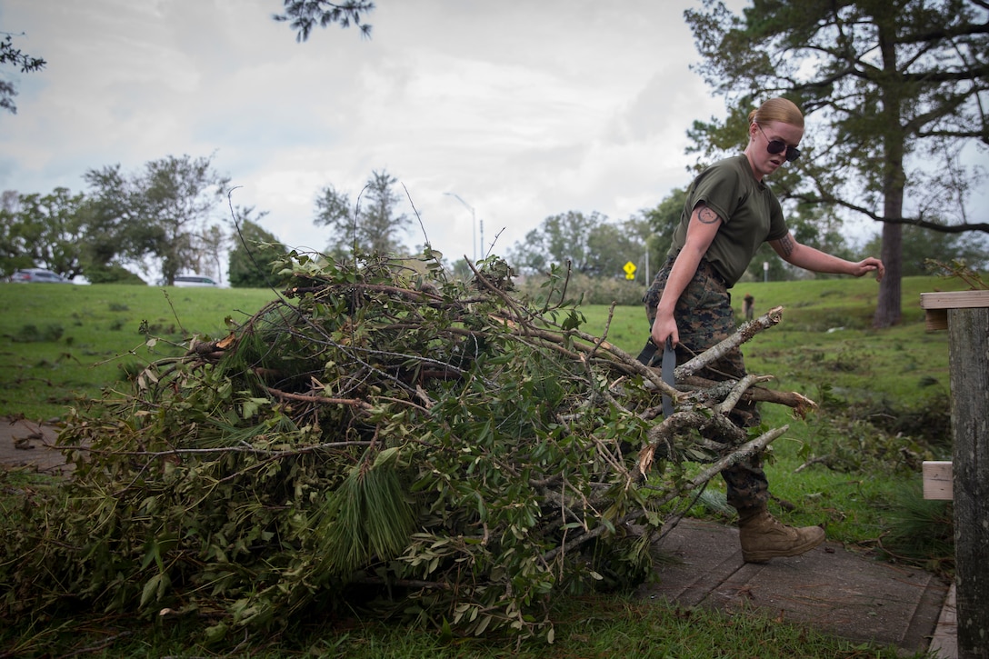U.S. Marine Corps Cpl. Kayla Buchanan with Service Company, Headquarters Regiment, 2nd Marine Logistics Group, hauls away debris at Camp Lejeune, N.C., Sept. 17, 2018. Recovery and repair efforts began on base Saturday, September 15, with the majority of efforts focused on clearing roadways and restoring power to critical areas aboard Camp Lejeune following Hurricane Florence. (U.S. Marine Corps photo by Sgt. Bethanie C. Sahms)