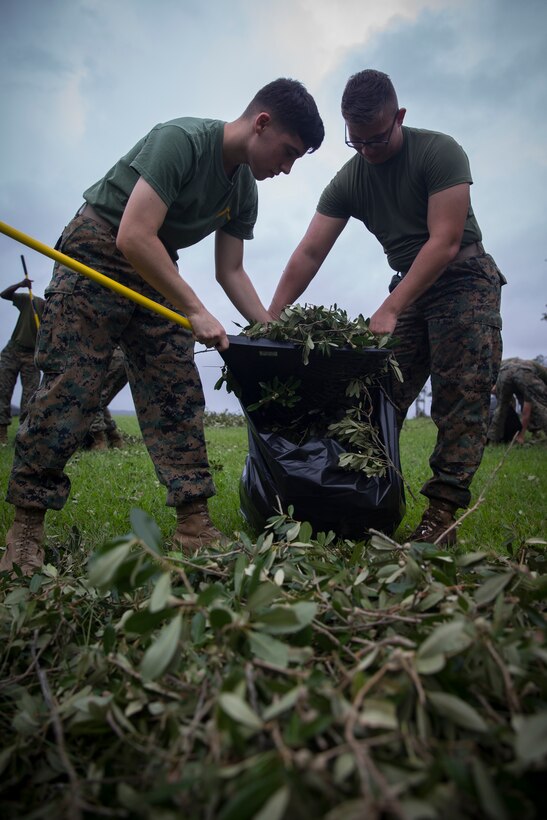 U.S. Marines with Headquarters Regiment, 2nd Marine Logistics Group, bag up broken tree branches and debris at Camp Lejeune, N.C., Sept. 17, 2018. Recovery and repair efforts began on base Saturday, September 15, with the majority of efforts focused on clearing roadways and restoring power to critical areas aboard Camp Lejeune following Hurricane Florence. (U.S. Marine Corps photo by Sgt. Bethanie C. Sahms)