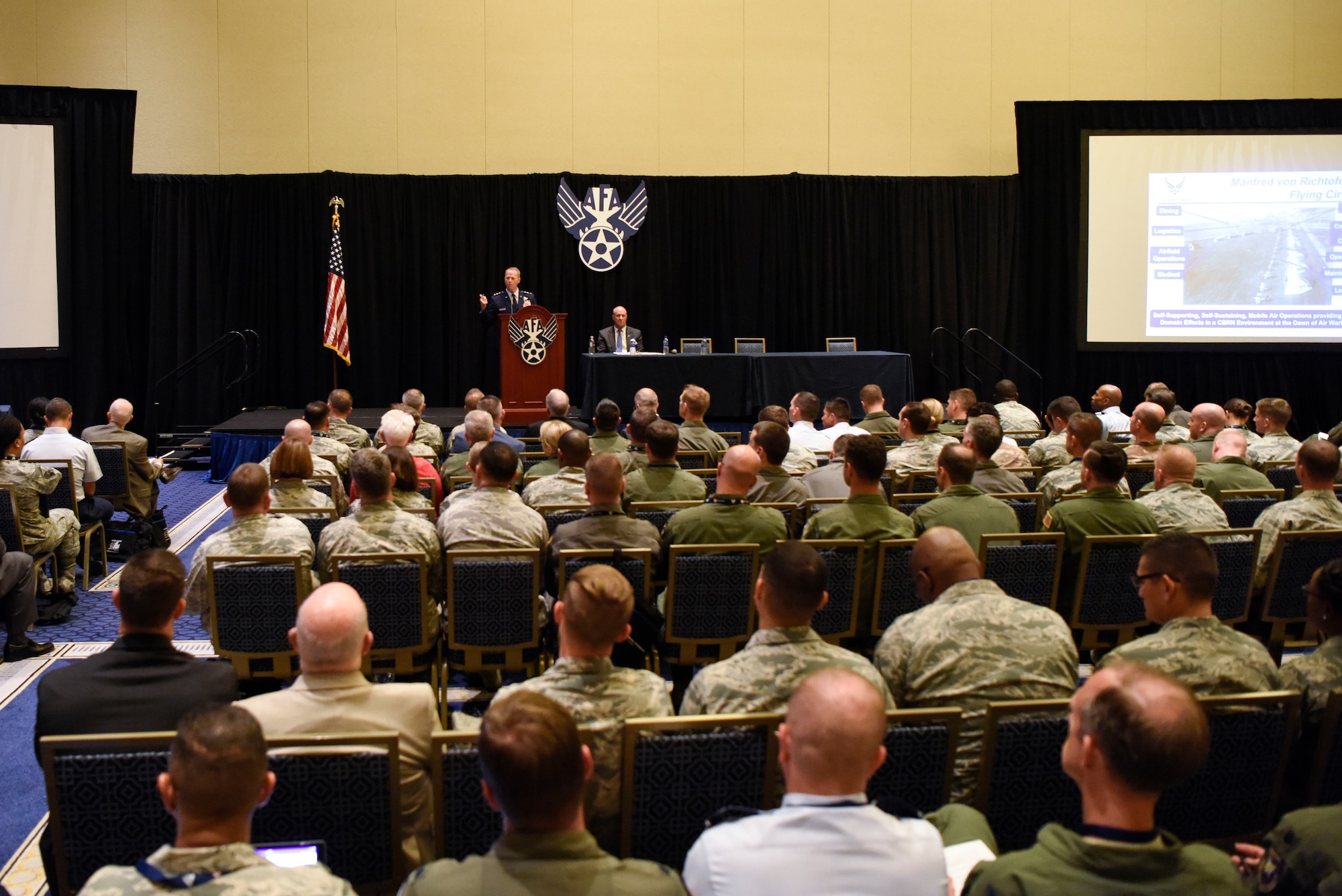 Airmen attend a speech on “The Force We Present” by Lt. Gen. Mark D. Kelly, Air Force deputy chief of staff or operations, during the Air Force Association’s Air, Space and Cyber Conference Sept. 17, 2018, in National Harbor, Md. The Air, Space and Cyber Conference is a professional development conference that offers an opportunity for Department of Defense personnel to participate in forums, speeches, seminars and workshops. (U.S. Air Force photo by Airman 1st Class Zoe M. Wockenfuss)