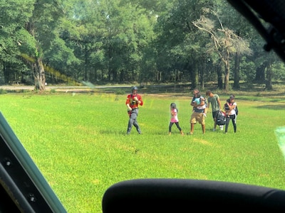 Alaska Air National Guardsmen from the 176th Wing’s 212th Rescue Squadron assist with recovering isolated flood survivors via a California ANG’s 129th Wing HH-60 Pave Hawk helicopter crewed by members of the 210th RQS near Sampson County, N.C., Sept. 17, 2018.