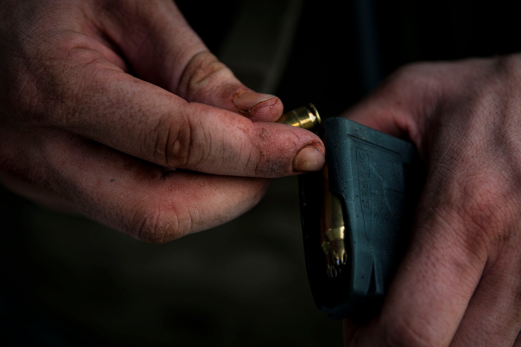 An Airman from Air Combat Command (ACC) loads a magazine during the 2018 Defender Challenge, Sept. 11, at Joint Base San Antonio-Camp Bullis, Texas. Teams representing all twelve Air Force major commands, the Royal Air Force Regiment and German Air Force participated in the friendly competition, which tested their capabilities in dismounted operations, combat endurance and weapons tactics. The ACC team won second place in the overall competition, combat endurance and weapons challenge. (U.S. Air Force photo by Airman Taryn Butler)