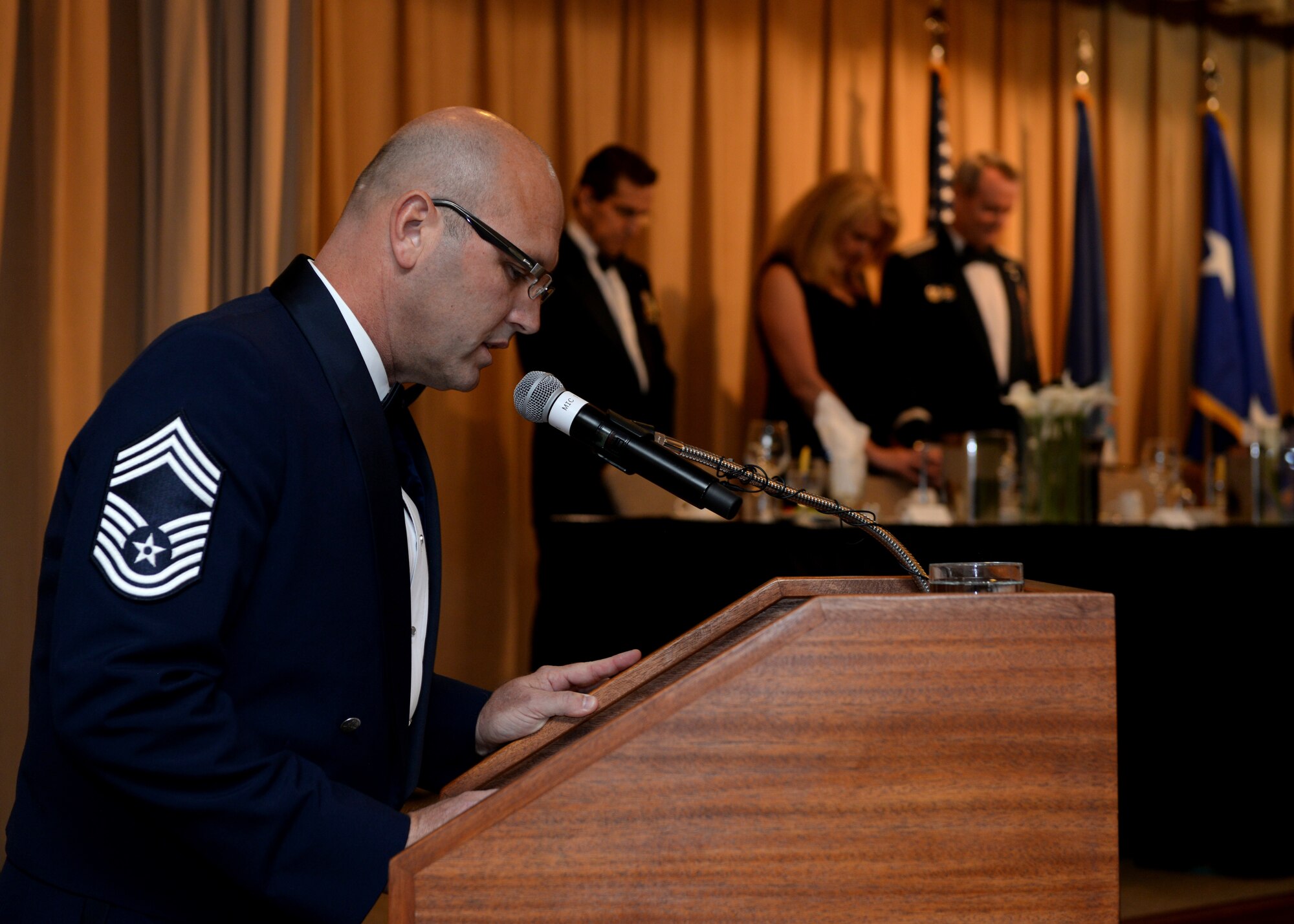 Chief Master Sgt. Charlie Mills, Profession of Arms Center of Excellence superintendent, provides the invocation during an Order of the Sword Ceremony honoring retired Lt. Gen. Darryl Roberson at Luke Air Force Base, Ariz., Sept. 13, 2018.