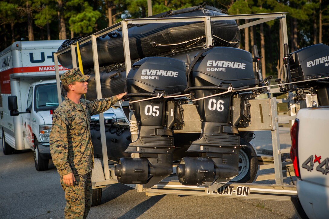 Sgt. Steven M. Holmes, a Small Craft Mechanic with 3rd Force Reconnaissance Company, 4th Marine Division, inspects a F470 Combat Rubber Raiding Craft at McCrady Training Center, South Carolina, Sept. 17, 2018. Reserve and active duty Marines and Sailors from Marine Forces North and Marine Forces Reserve are poised to support the Department of Defense in their efforts to provide FEMA with unique capabilities resident in their inventory. (U.S. Marine Corps photo by Cpl. Andy O. Martinez)