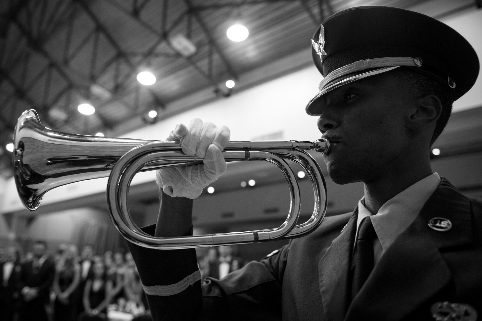 Airman 1st Class Michael Wilson-Jones, 23d Wing Honor Guard drill team member, plays taps to commemorate the Air Force’s 71st Birthday during the Air Force Ball, Sept. 15, 2018, at the James H. Rainwater Conference Center in Valdosta, Ga. Moody’s Air Force Ball was not only a celebration of the Air Force’s 71st Birthday but a way to foster esprit de corps and pride among Airmen through a shared history of exceptional service. (U.S. Air Force photo illustration by Airman 1st Class Erick Requadt)