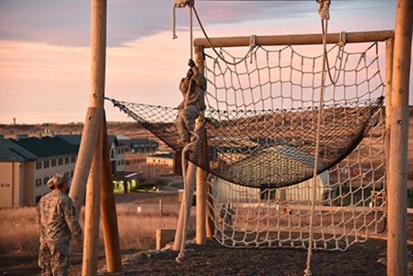 Spc. Devan Romero-Bernal, a Colorado Army National Guard Soldier, climbs a rope obstacle at the Best Warrior Competition Sunday April 10, 2016, at Fort Carson, Colorado. Ten guardsmen total competed in the state competition. (photo by U.S. Army Staff Sgt. Manda Walters/Released)