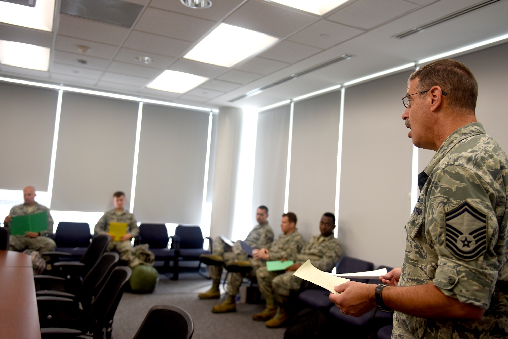 U.S. Air Force Senior Master Sgt. Gene Katz, operations and compliance superintendent with the 145th Logistics Readiness Squadron, briefs personnel assigned to an 11-person team ready to assist in Hurricane Florence Relief efforts at the North Carolina (N.C.) Air National Guard Base, Charlotte Douglas International Airport, Sept.17, 2018.  The 11-person team will create and move pallets filled with supplies like food and water in a Kinston, N.C. airport.