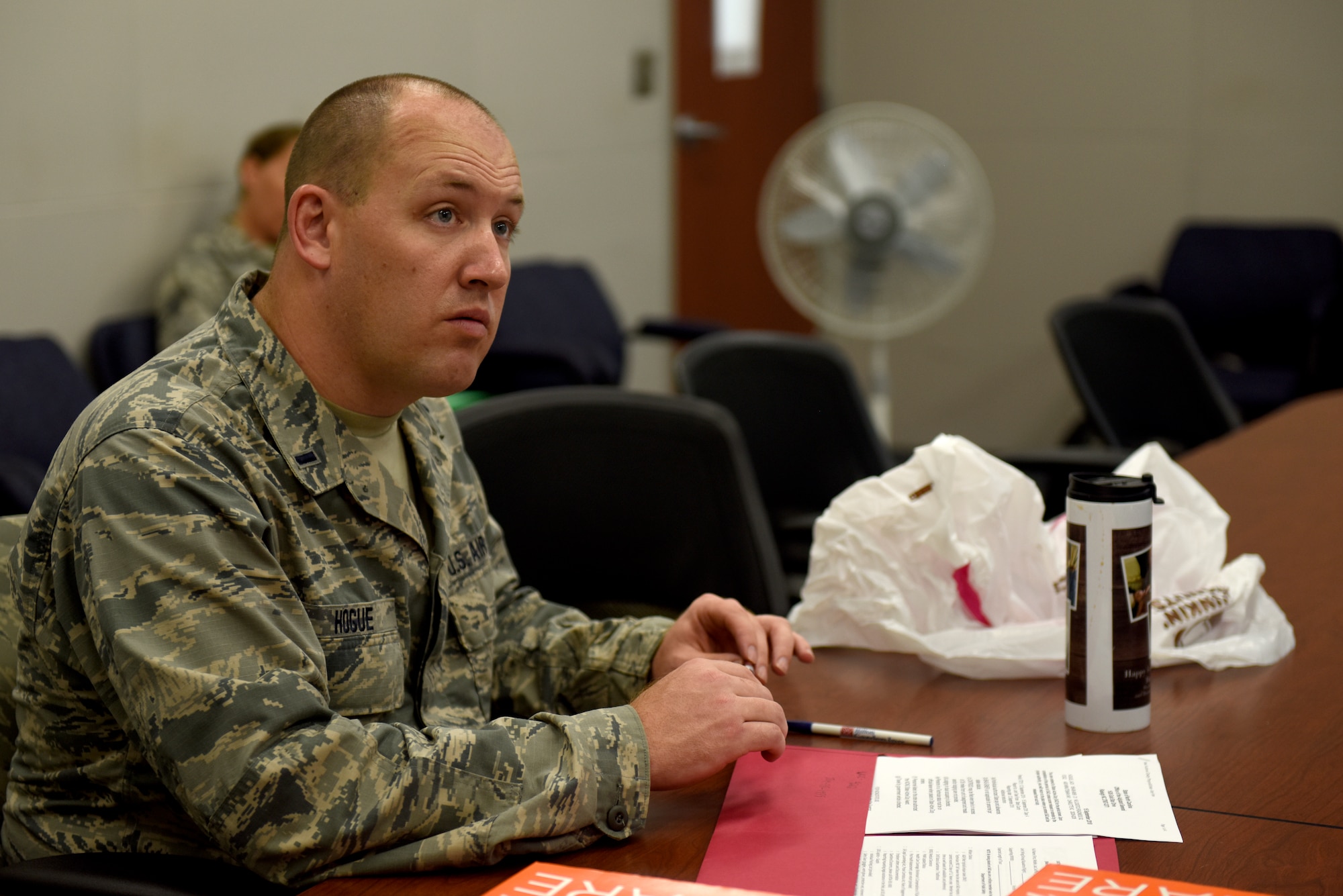 U.S. Air Force 1st Lt. Jack Hogue, operations officer with the 145th Logistics Readiness Squadron (LRS), listens as Senior Master Sgt. Gene Katz, operations and compliance superintendent with the 145th LRS briefs personnel assigned to an 11-person team ready to assist in Hurricane Florence Relief efforts at the North Carolina (N.C.) Air National Guard Base, Charlotte Douglas International Airport, Sept.17, 2018.  The 11-person team will create and move pallets filled with supplies like food and water in a Kinston, N.C. airport.