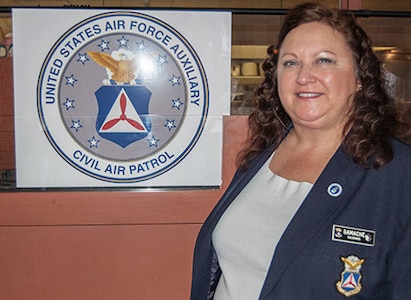 Retired U.S. Air Force Maj. Celeste Gamache, commander of Colorado Wong of the Civil Air Patrol, sponsors an event on behalf of CAP in Denver Dec. 4, 2015. (U.S. Air National Guard photo by Tech. Sgt. Jecca Geffre/Released)