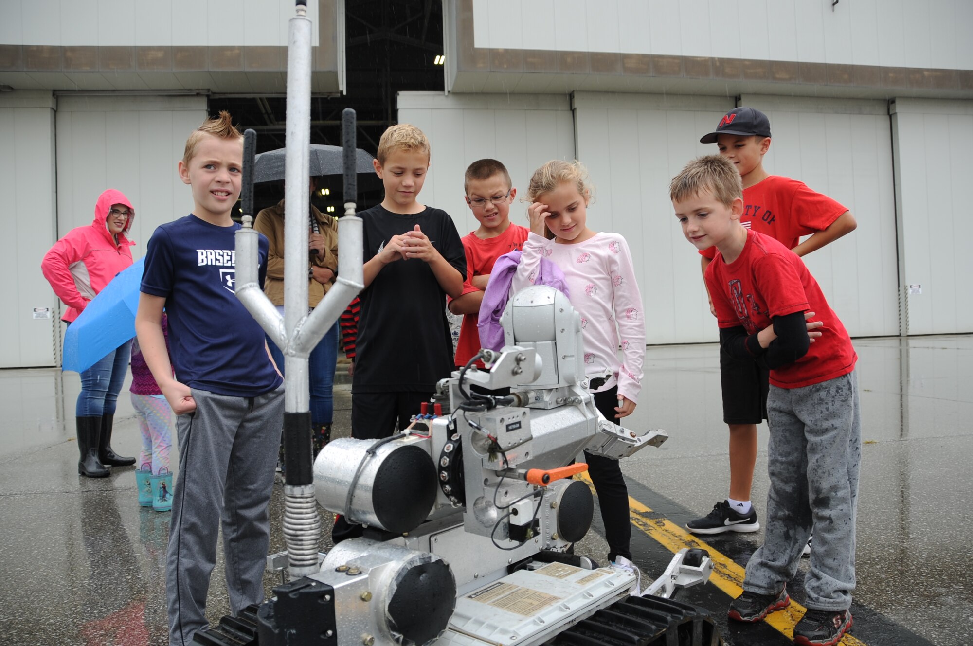 Children interact with an explosive ordnance disposal robot during Family Appreciation Day at Grissom Air Reserve Base, Ind., Sept. 8, 2018. Airmen and their families were invited to have lunch and participate in various activities on base. (U.S. Air Force photo / Senior Airman Harrison Withrow)