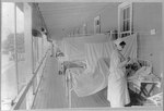 A nurse takes a patient’s pulse in the influenza ward at Walter Reed Hospital in Washington, D.C., near the end of the Spanish Flu epidemic, Nov. 1, 1918. Fresh air was believed to help prevent the spread of the disease, which killed 50 million to 100 million people worldwide. Pandemic flus such as this are rare, occurring just three times in the 20th century, according to the Centers for Disease Control and Prevention.
