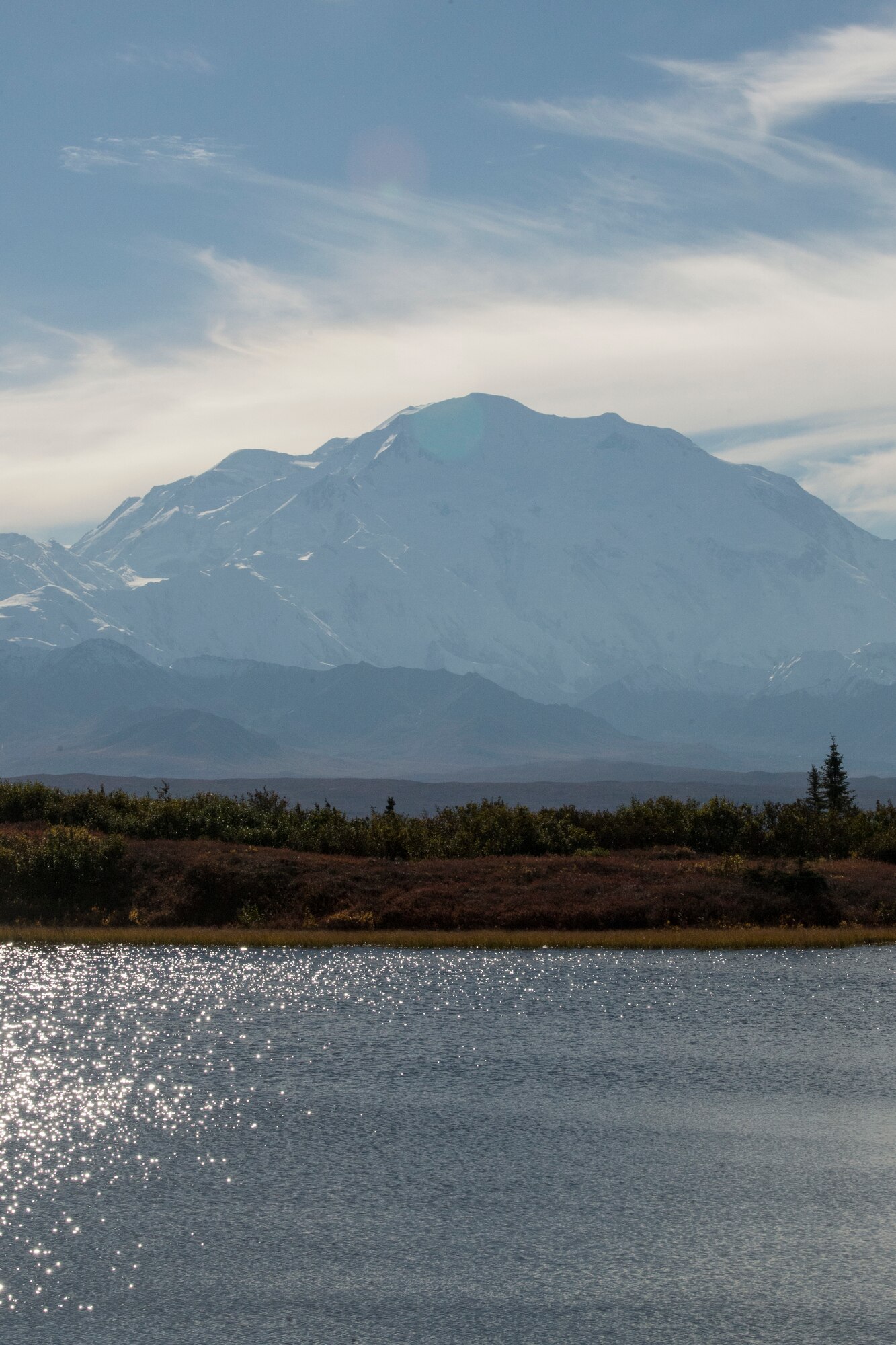 Denali is visible to visitors at Reflection Pond during Military Appreciation Day at Mile 85.3 in Denali National Park and Preserve, Alaska, Sept. 15, 2018. The 11th annual Military Appreciation Day included 400 “road lottery” tickets given out to Alaska-based service members. With the warm, dry weather conditions this year, road lottery recipients were given the chance to drive out to the end of the park road at Mile 92.