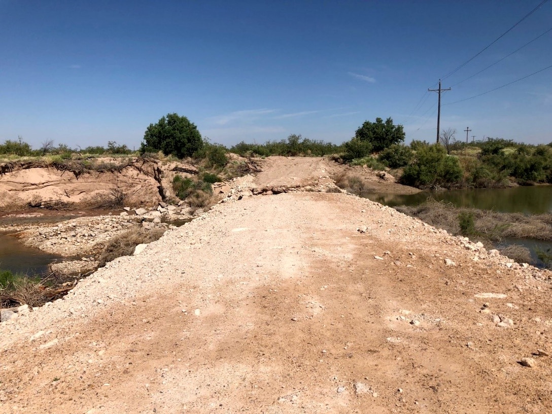 The unauthorized dam, built by Loving County Water Improvement District. The dam was built of broken concrete, petro calcic rock, and sediment.