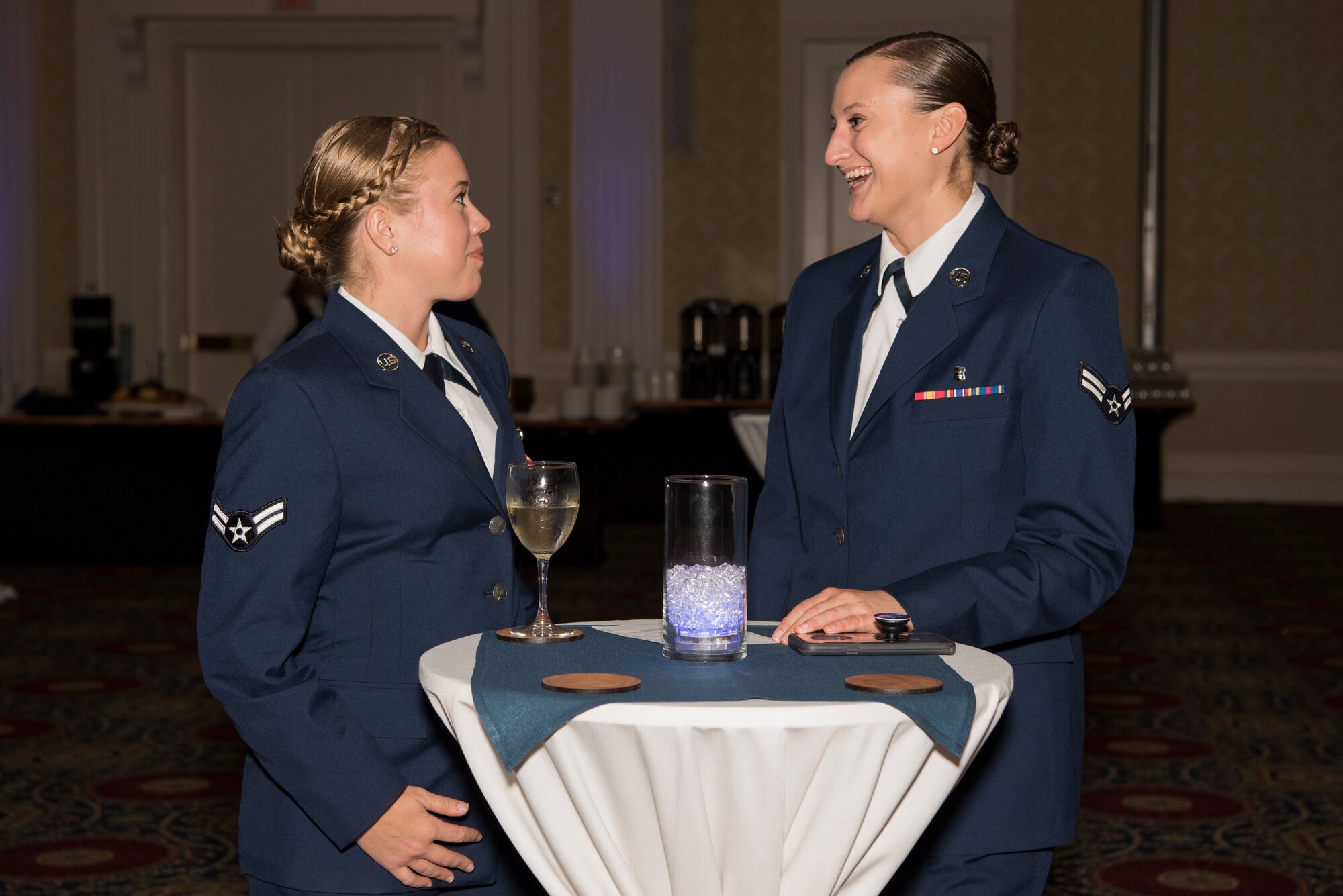 From left, Airmen 1st Class Jessika Ilgen and Jessica Gasvoda, 436th Aerospace Medicine Squadron bioenvironmental engineering technicians, laugh together during the Air Force Ball Sept. 15, 2018, in Dover, Del. New members of Team Dover, Ilgen and Gasvoda attended the first Air Force Ball in their careers. (U.S. Air Force photo by Staff Sgt. Aaron J. Jenne)