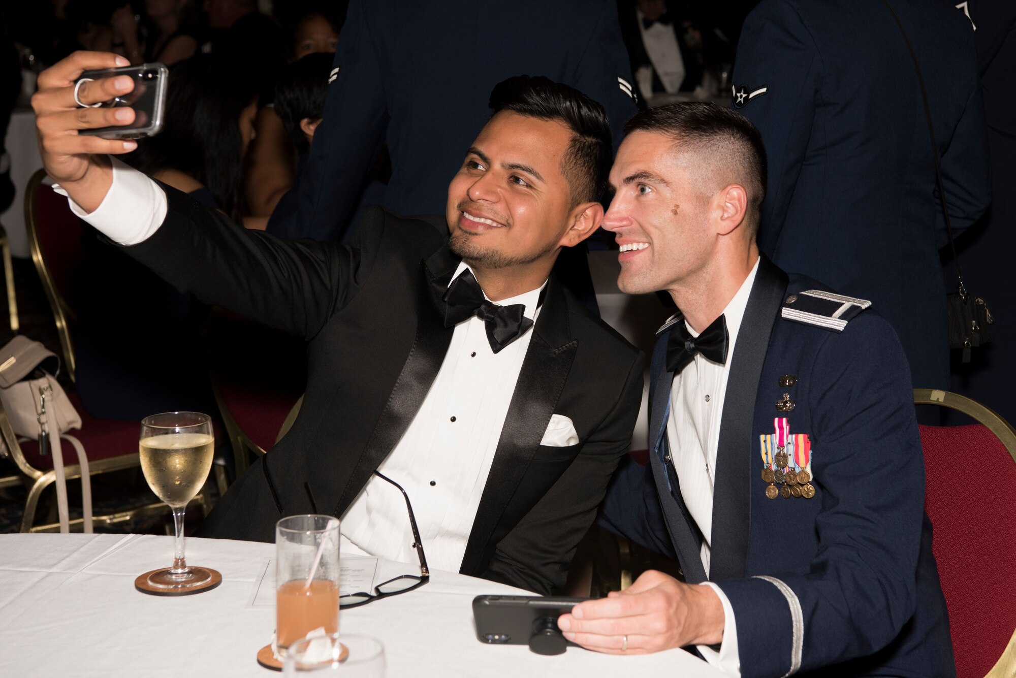 First Lt. Joey Keyes (right), 512th Force Support Squadron military personnel section commander, poses for a selfie with his husband, Pablo, during the Air Force Ball Sept. 15, 2018, in Dover, Del. An annual event, the Air Force Ball celebrates the heritage of the service branch, established Sept. 18, 1947. (U.S. Air Force photo by Staff Sgt. Aaron J. Jenne)