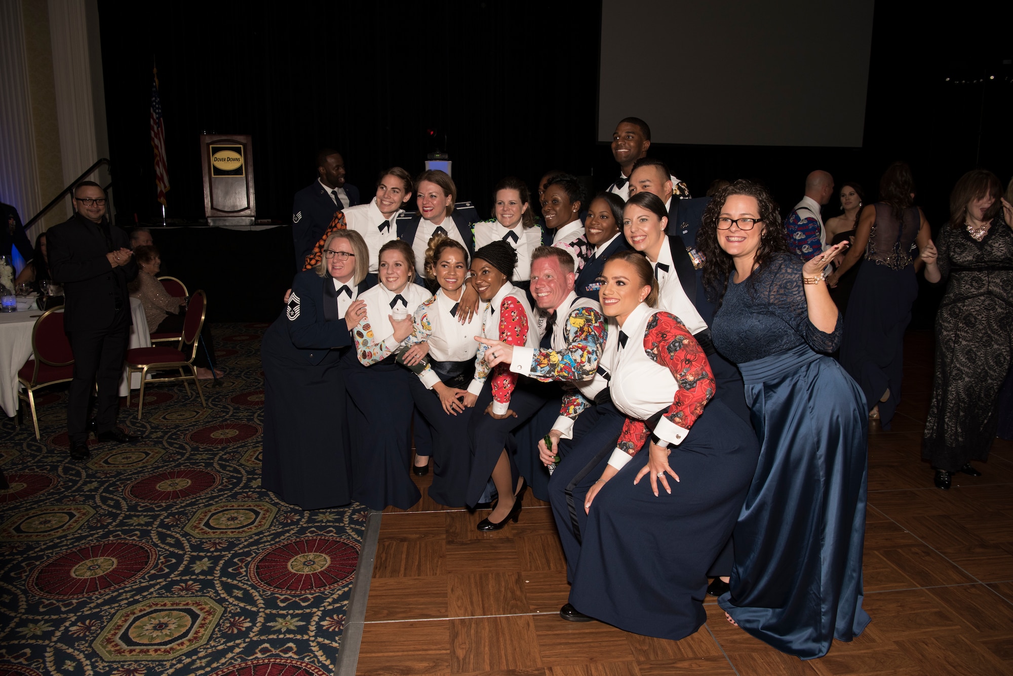 Team Dover members pose for a group photo Sept. 15, 2018, during the Air Force Ball in Dover, Del. The ball celebrates service branch’s heritage and honor’s the branch’s inception Sept. 18, 1947. (U.S. Air Force photo by Staff Sgt. Aaron J. Jenne)