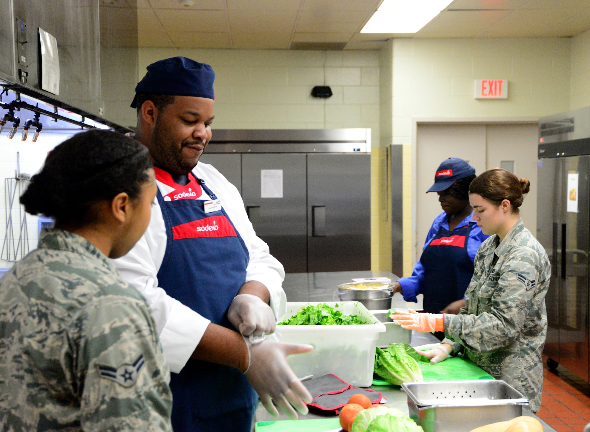 From left, Airman First Class Iyana Green, 436th Force Support Squadron food service apprentice, Hassan Amenu-el, line cook, Shemya Singletary, Sodexo supervisor, and Airman 1st Class Katie Magar, 436th Force Support Squadron food service apprentice, work to prepare lunch Sept. 14, 2018, at the Patterson Dining Facility on Dover Air Force Base, Del. Preparing fresh food each day is one of the practices the DFAC uses to maintain quality standards for the food they serve. (U.S. Air Force photo by Airman 1st Class Dedan Dials)