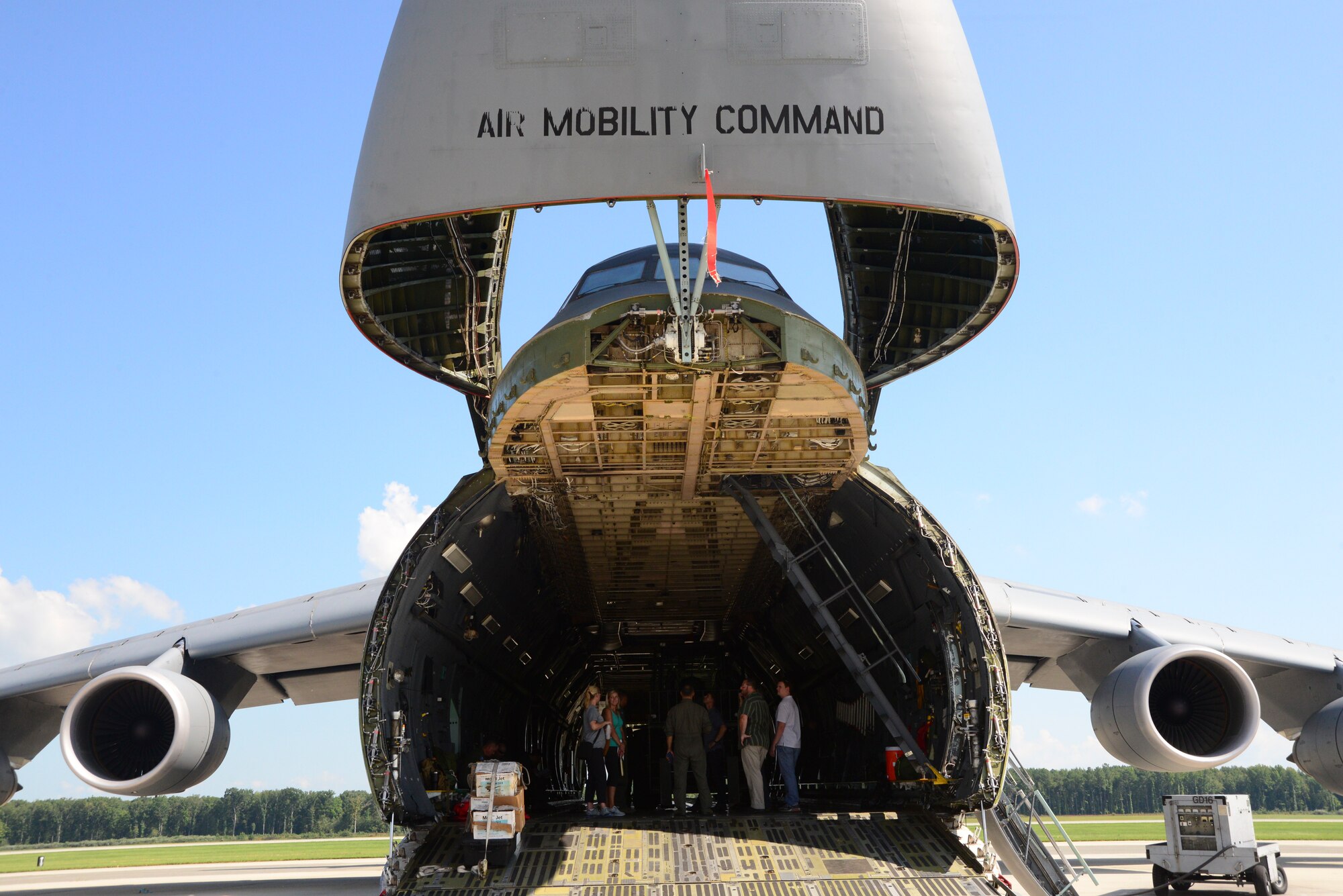 Loadmasters and members of the Marine Corps Systems Command land systems defense acquisition team discuss airlift operations aboard a static C-5M Super Galaxy Sept 5, 2018, at Dover Air Force Base, Del. MARCORSYSCOM is responsible for equipment development. Their visit to Dover AFB was intended to improve their partnership with Air Force loadmasters, who are responsible for movine Marine Corps equipment to the warfighter. (U.S. Air Force photo by Airman First Class Jonathan Harding)