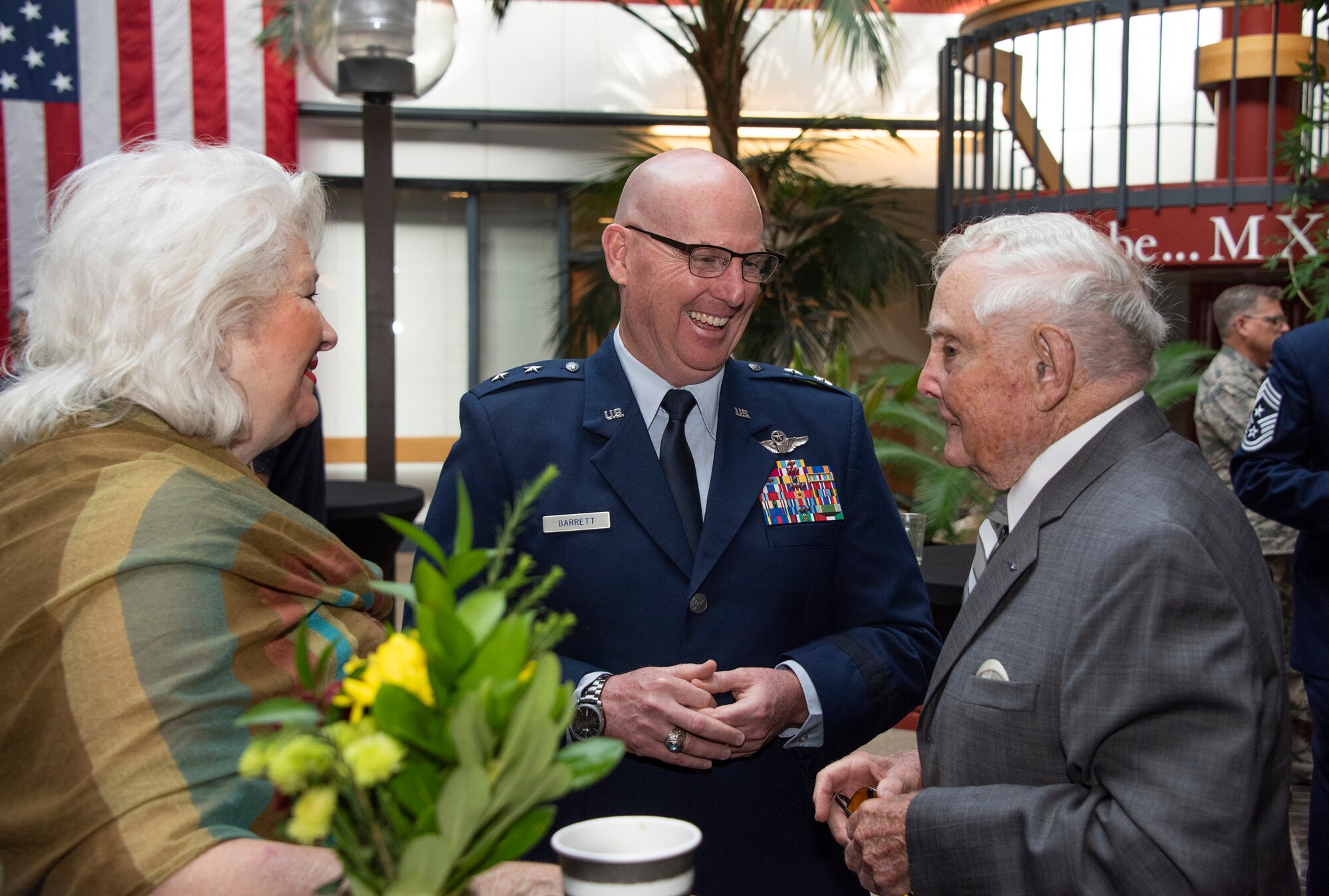 Maj. Gen. Sam Barrett, 18th Air Force commander, speaks with retired Lt. Gen. John Gonge, prior to an assumption of command ceremony at Travis Air Force Base, Calif., Sept. 18, 2018. Gonge commanded the 22nd Air Force at Travis from August 1972 to August 1975. (U.S. Air Force photo by Heide Couch)
