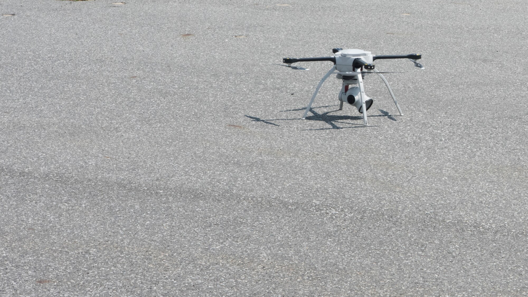 The 8th Civil Engineer Squadron Aeryon SkyRanger drone sits on the tarmac prior to performing the Air Force’s first-ever operational rapid airfield damage assessment at Kunsan Air Base, Republic of Korea, Aug. 13, 2018. This innovative survey method gives commanders real-time information on airfield conditions following an airfield attack. (U.S. Air Force photo by Staff Sgt. Levi Rowse)