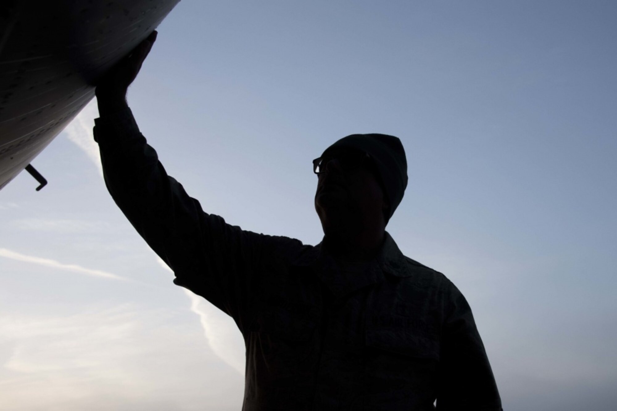 U.S. Air Force Lt. Col. Larry Henderson, a chaplain assigned to the 343rd Expeditionary Bomb Squadron, blesses a B-52 Stratofortress at RAF Fairford, England, Sept. 15, 2018. The 343rd EBS supported both Ample Strike 18 and Bomber Task Force operations during its time at the base. (U.S. Air Force photo by Master Sgt. Ted Daigle)