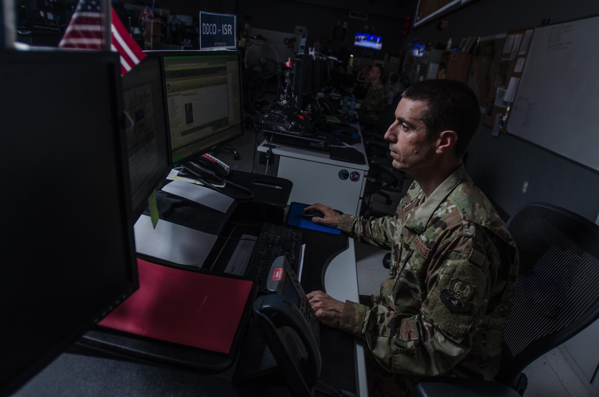 An Airman assigned to the 609th Air Operations Center works on the combat operations division floor at the Combined Air Operations Center at Al Udeid Air Base, Qatar, June 16, 2017. Despite Hurricane Florence hitting South Carolina last week, Airmen assigned to the 609th AOC Detachment 1 at Shaw Air Force Base, South Carolina, continued operations without interruption in support of U.S. Central Command military operations. AFCENT has adopted a distributed command and control model for operations, meaning organizations at multiple locations enable combat operations. (U.S. Air Force photo by Staff Sgt. Alexander W. Riedel)