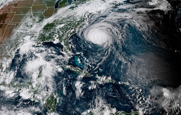 A satellite image of Hurricane Florence shows the storm off the coast of North Carolina.  Florence made landfall as a category one storm.  Despite the storm’s surge, rain and wind, Airmen assigned to the 609th Air Operations Center and U.S. Air Forces Central Command (AFCENT) at Shaw Air Force Base, South Carolina, continued supporting AFCENT military operations in the U.S. Central Command area of responsibility. (U.S. Air Force Photo)