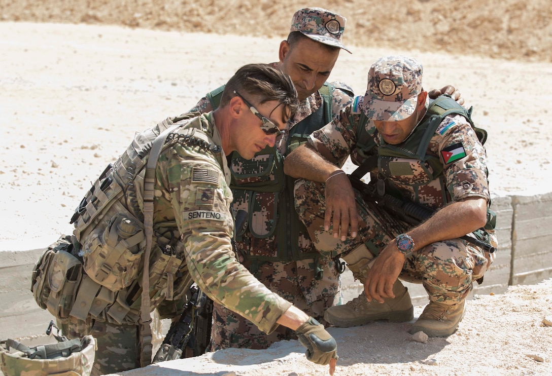 U.S Army Staff Sgt. Edmund Senteno, an infantry squad leader, assigned to Alpha Company, 1st Battalion, 155th Infantry Regiment, 155th Armored Brigade Combat Team, Task Force Spartan, discusses squad movement tactics with Jordanian soldiers during small arms training, near Alexandria, Egypt, Sept. 15, 2018. The 155th ABCT is in the Arab Republic of Egypt taking part in Exercise Bright Star 18, a multilateral U.S. Central Command training exercise. (U.S. Army photo by Sgt. James Lefty Larimer)