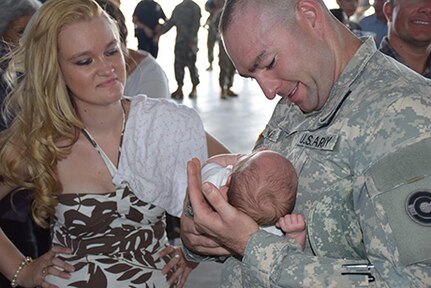 Members of the Colorado Army National Guard 193rd Military Police Battalion and 220th Military Police Company are met by family, friends and dignitaries for the units welcome home ceremony Sept. 5, 2015 at hanger 909, Buckley Air Force Base, Aurora, Color