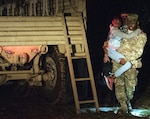 South Carolina Army National Guard Soldiers with the 1053rd Transportation Company assist a family that was trapped inside their vehicle during the early morning hours as a result of flood waters on the roadway in Hamer, S.C., Sept. 18, 2018. Rescues are underway in hard-hit North Carolina as well.