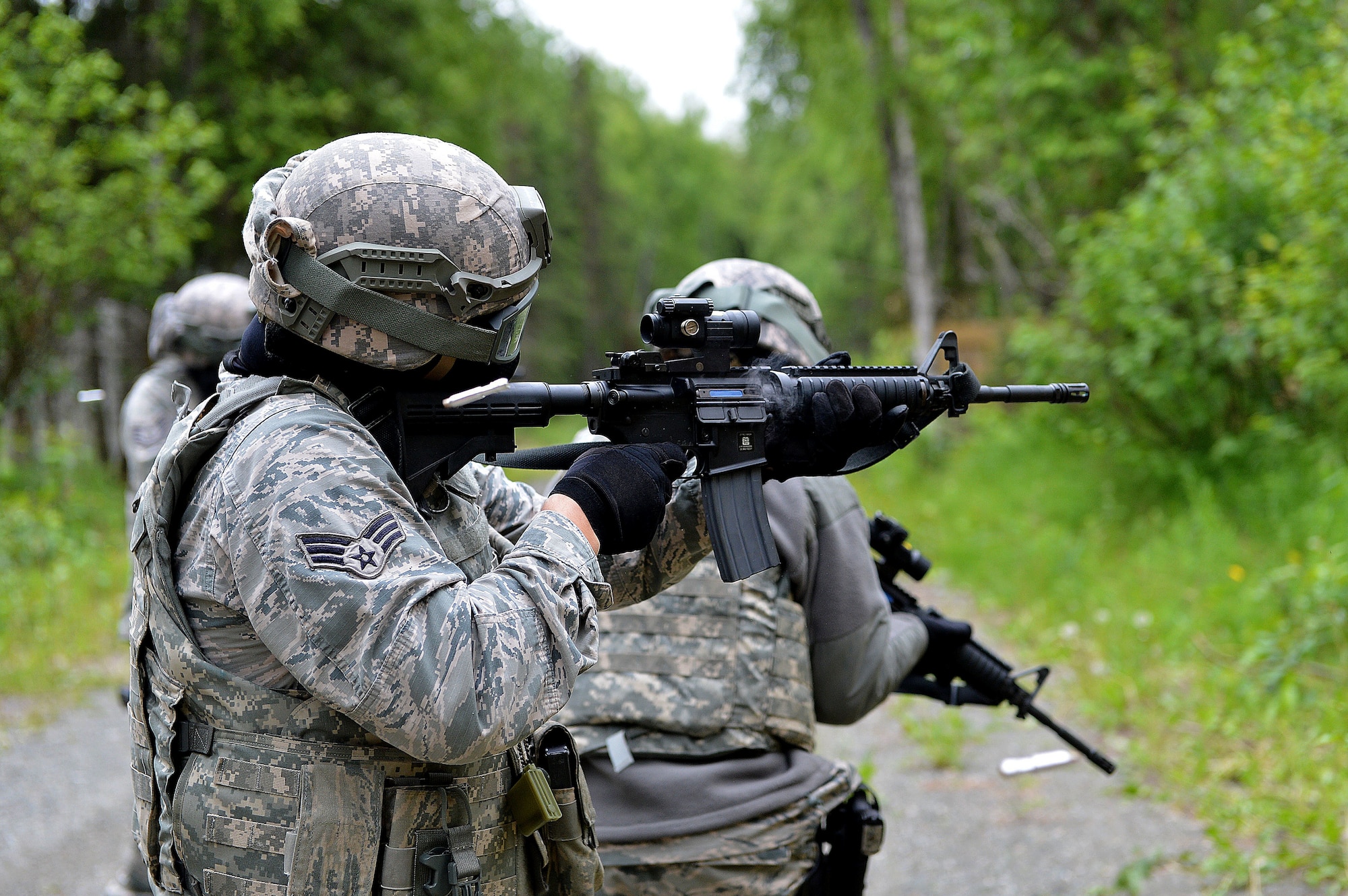 Airman 1st Class Grace Chvatal, a security forces specialist with the 155th Security Forces Squadron from the 155th Air Refueling Wing, Nebraska, takes part in a Shoot, Move, and Communicate exercise June 22, 2017, at Joint Base Elmendorf-Richardson, Alaska. 
 (U.S. Air Force photo taken by Airman 1st Class Jamie Titus/ Released)