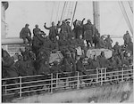 Soldiers of the New York Army National Guard's 369th Infantry Regiment arrive back in New York harbor on Feb. 12, 1919, after serving in France during World War I. The 369th was an African-American unit in a segregated Army which had served under French Army command but earned so many awards for heroism that they became known as the Harlem Hellfighters.