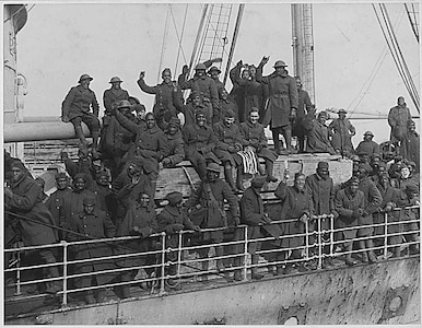 Soldiers of the New York Army National Guard's 369th Infantry Regiment arrive back in New York harbor on Feb. 12, 1919, after serving in France during World War I. The 369th was an African-American unit in a segregated Army which had served under French Army command but earned so many awards for heroism that they became known as the Harlem Hellfighters.
